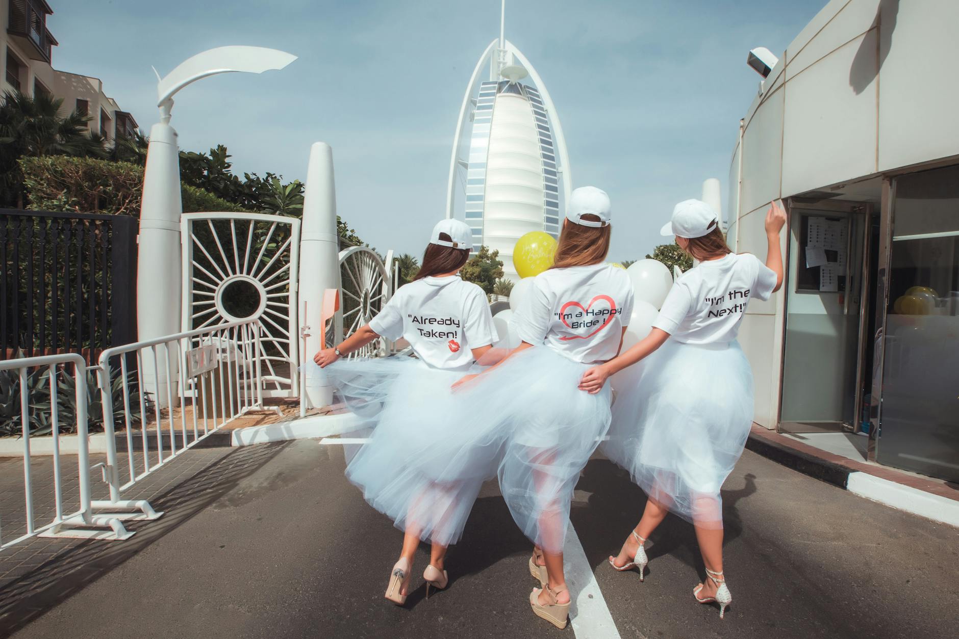 bride and her bridesmaids returning to the burj al arab hotel