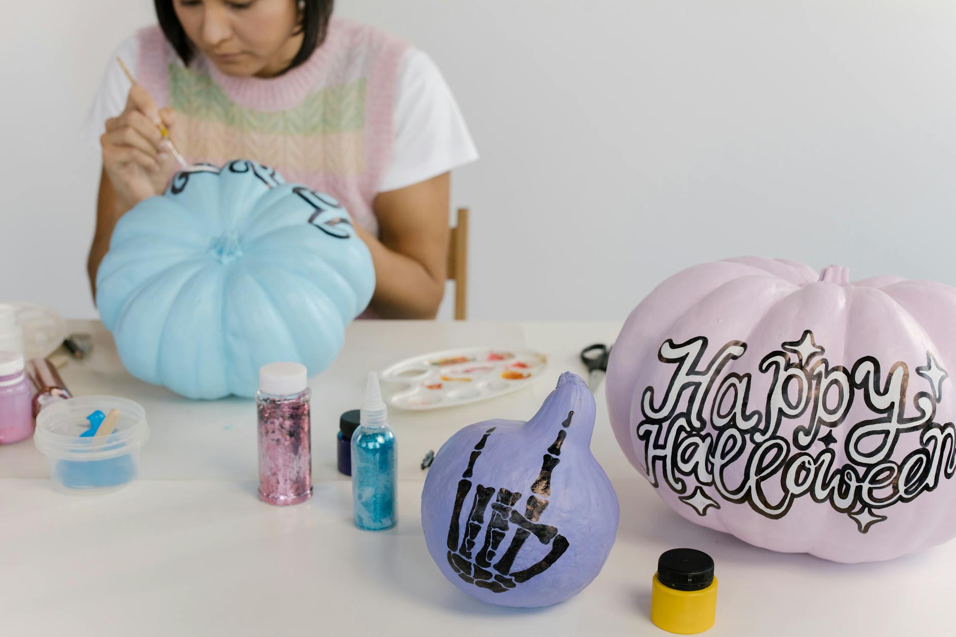 a woman designing halloween materials