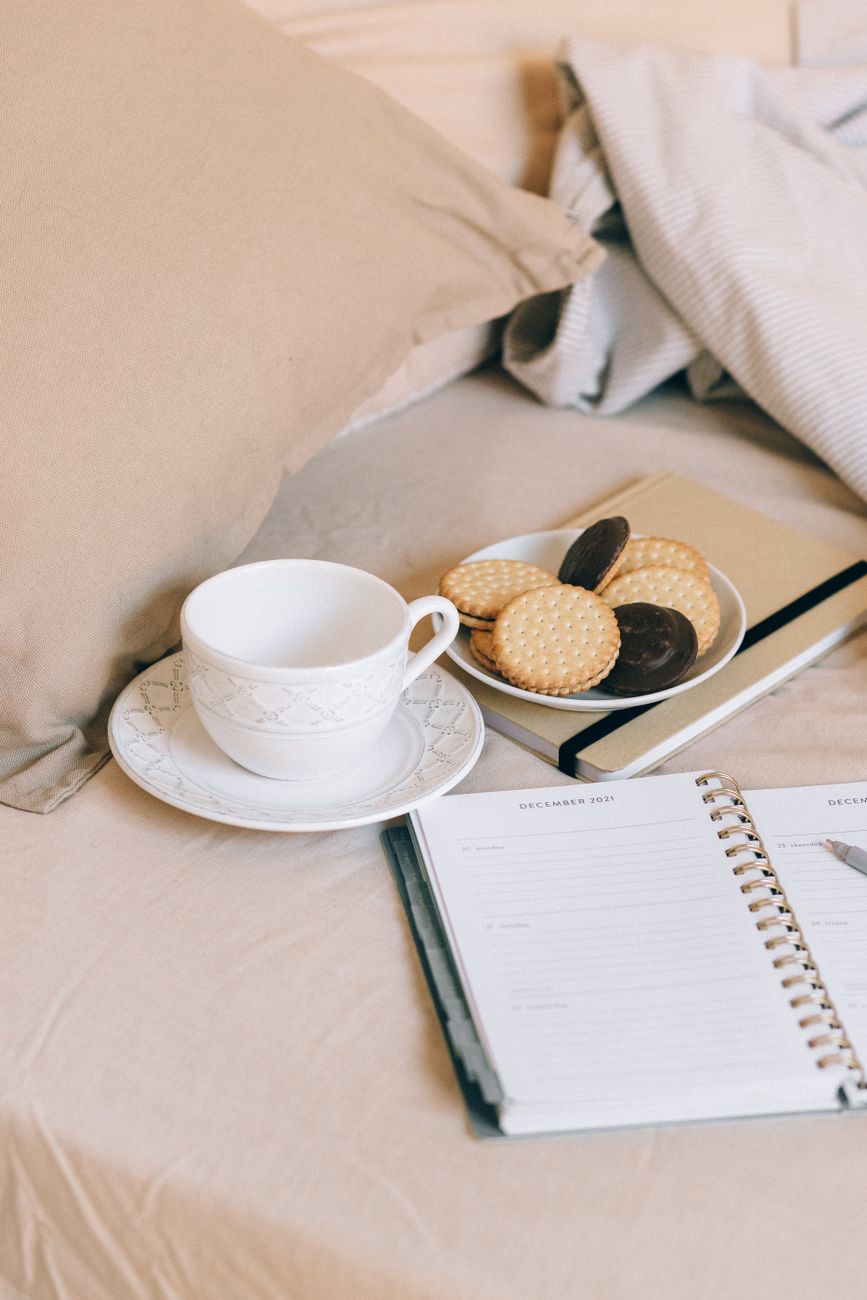 biscuits on a saucer on top of a notebook