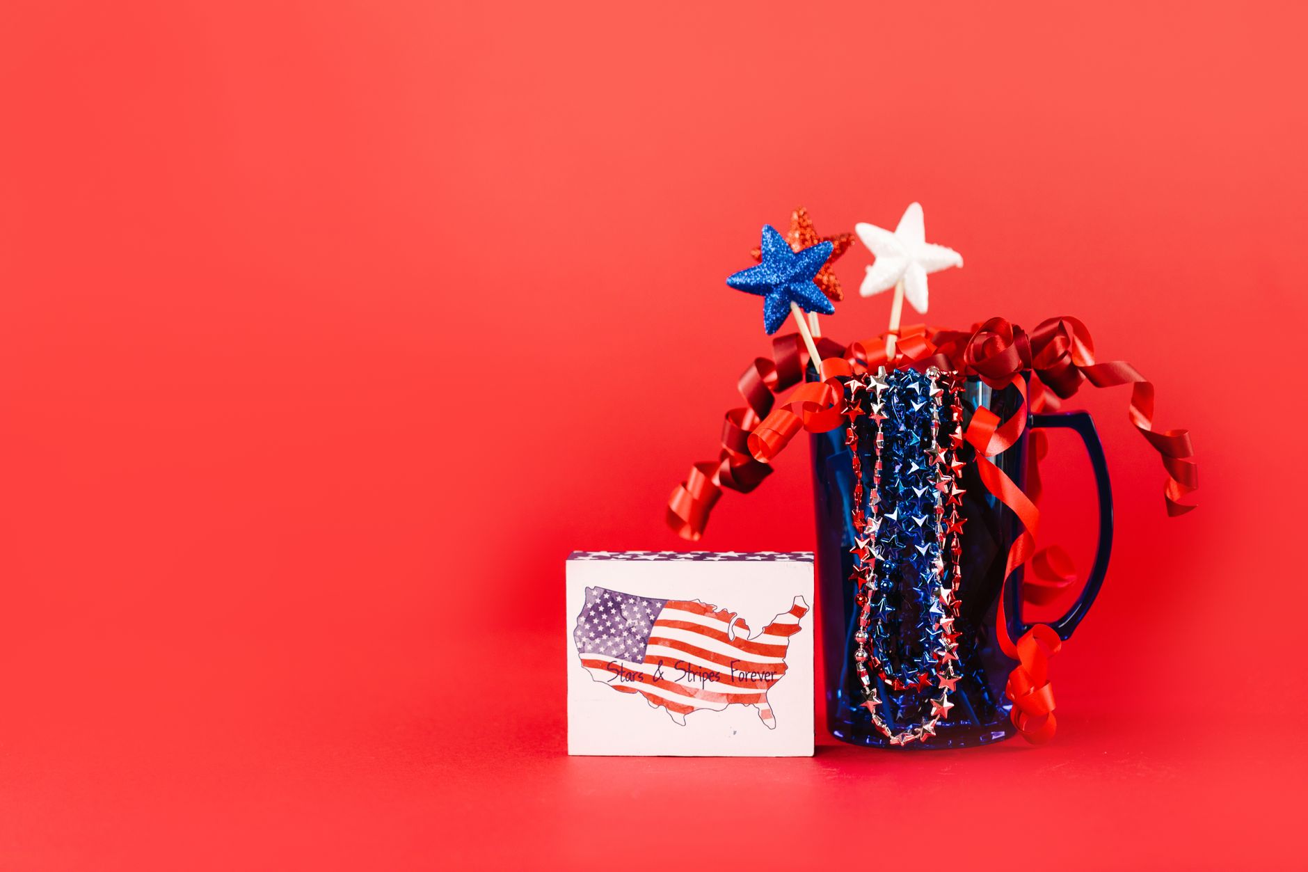 a fourth of july decorations on a red background