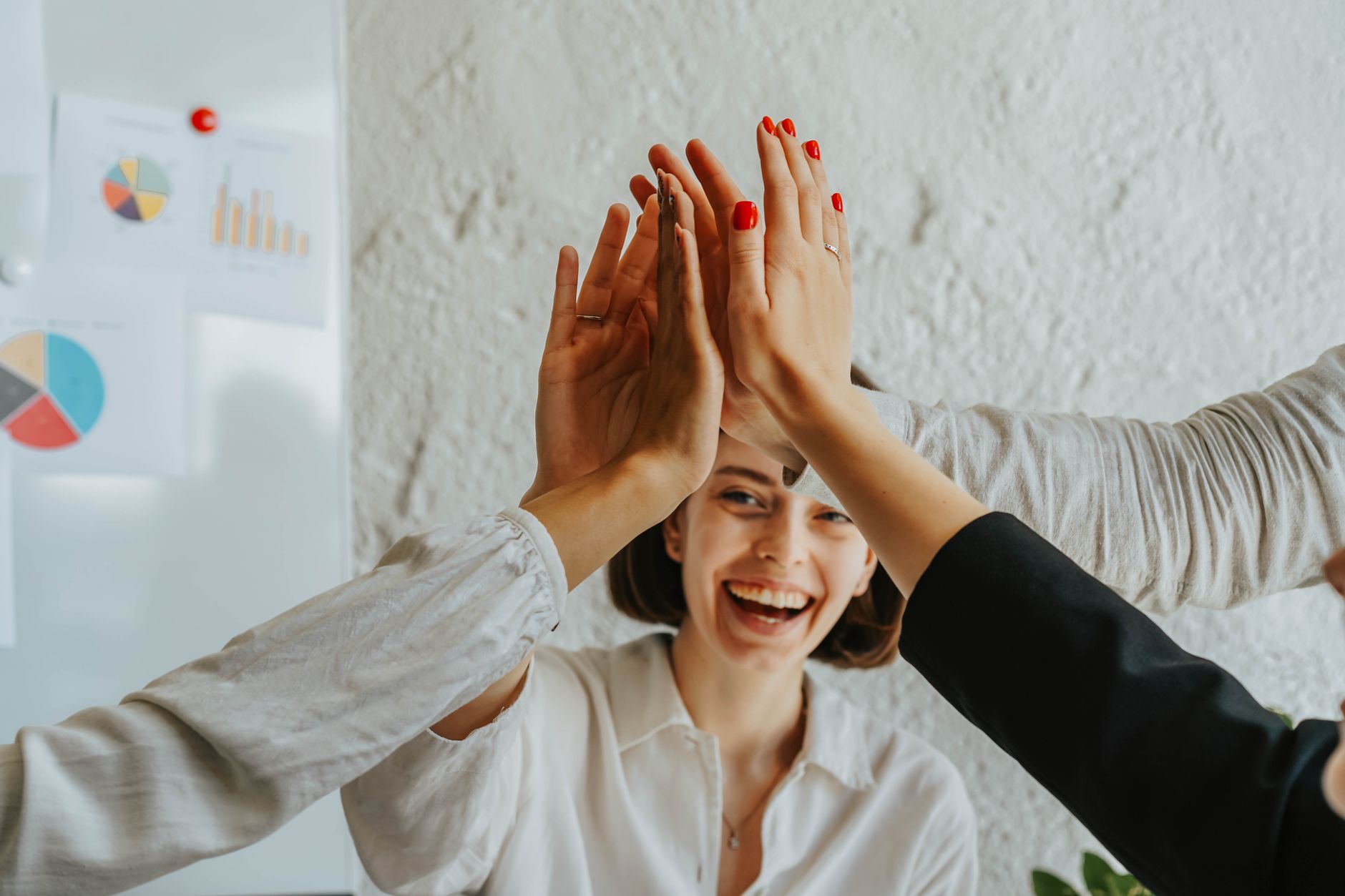 a group of people doing a high five