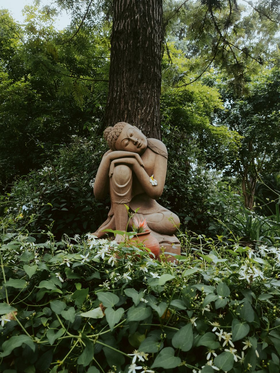 buddhist statue in garden