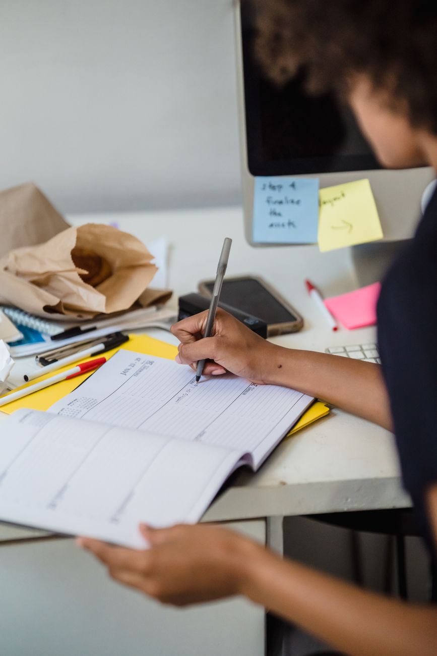 woman noting in calendar