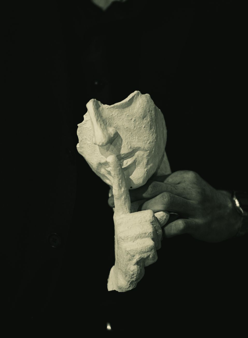 hand holding abstract sculpture