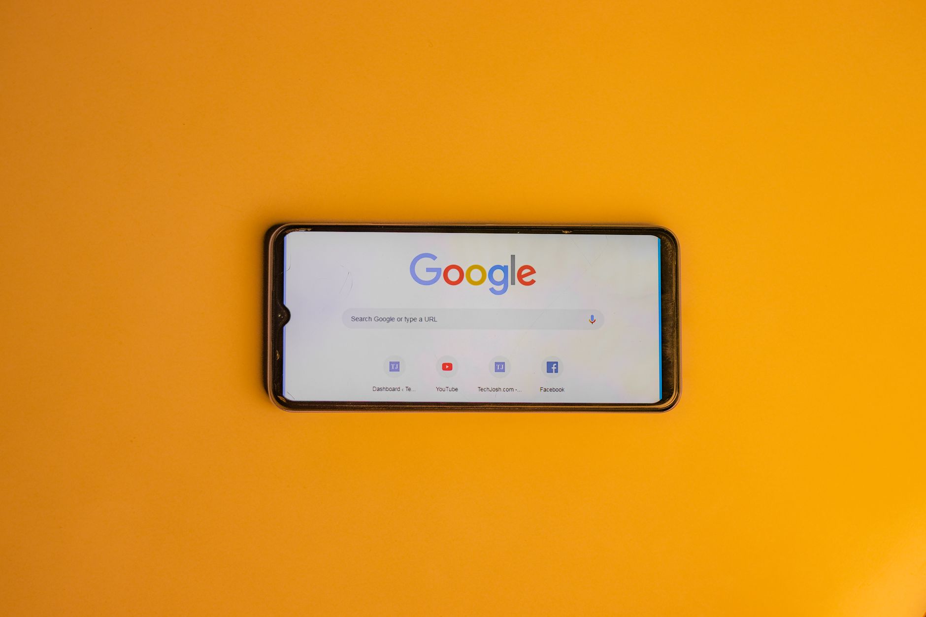 smart phone with a google search page on its display