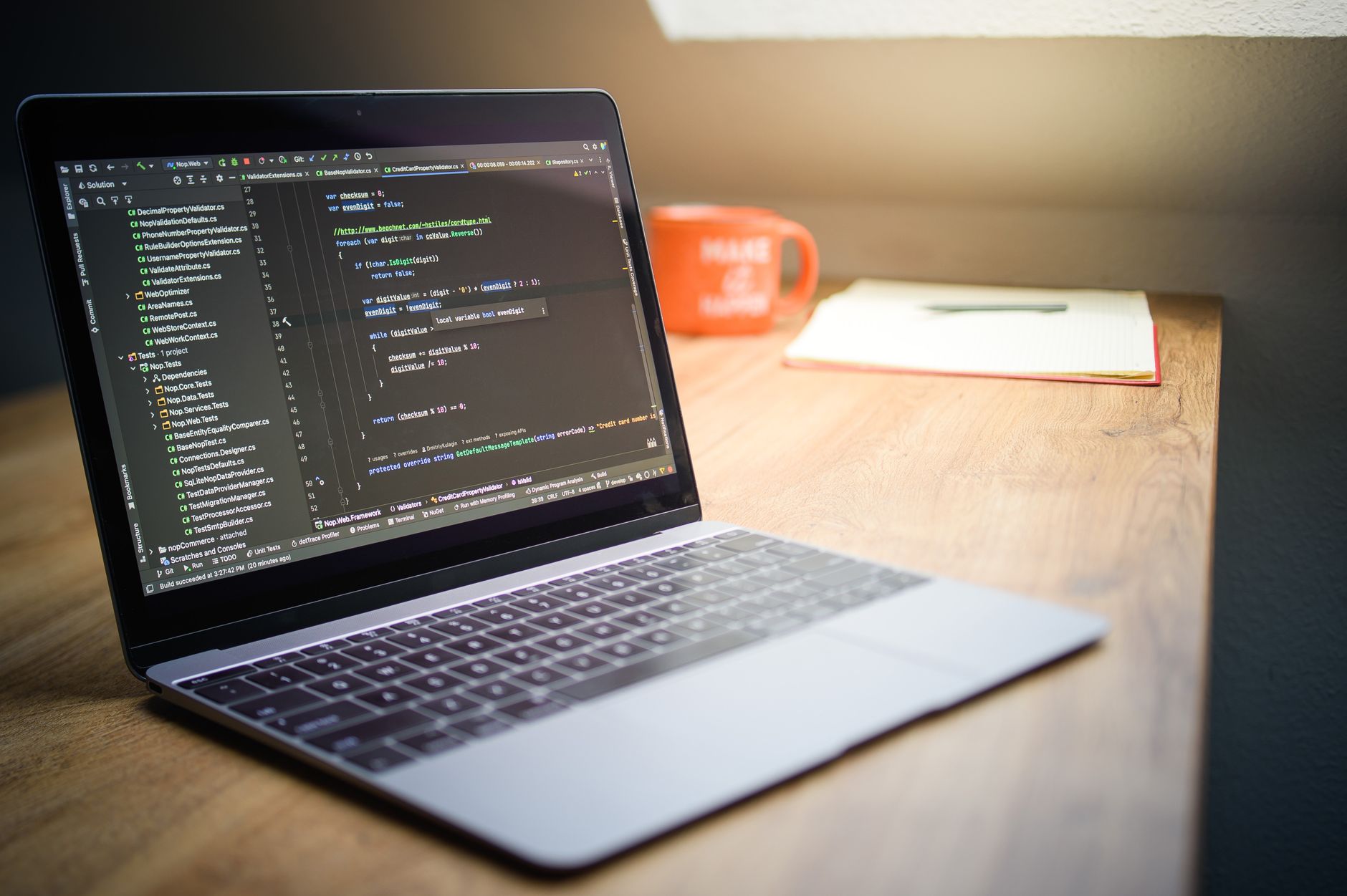 modern workspace with laptop and code display