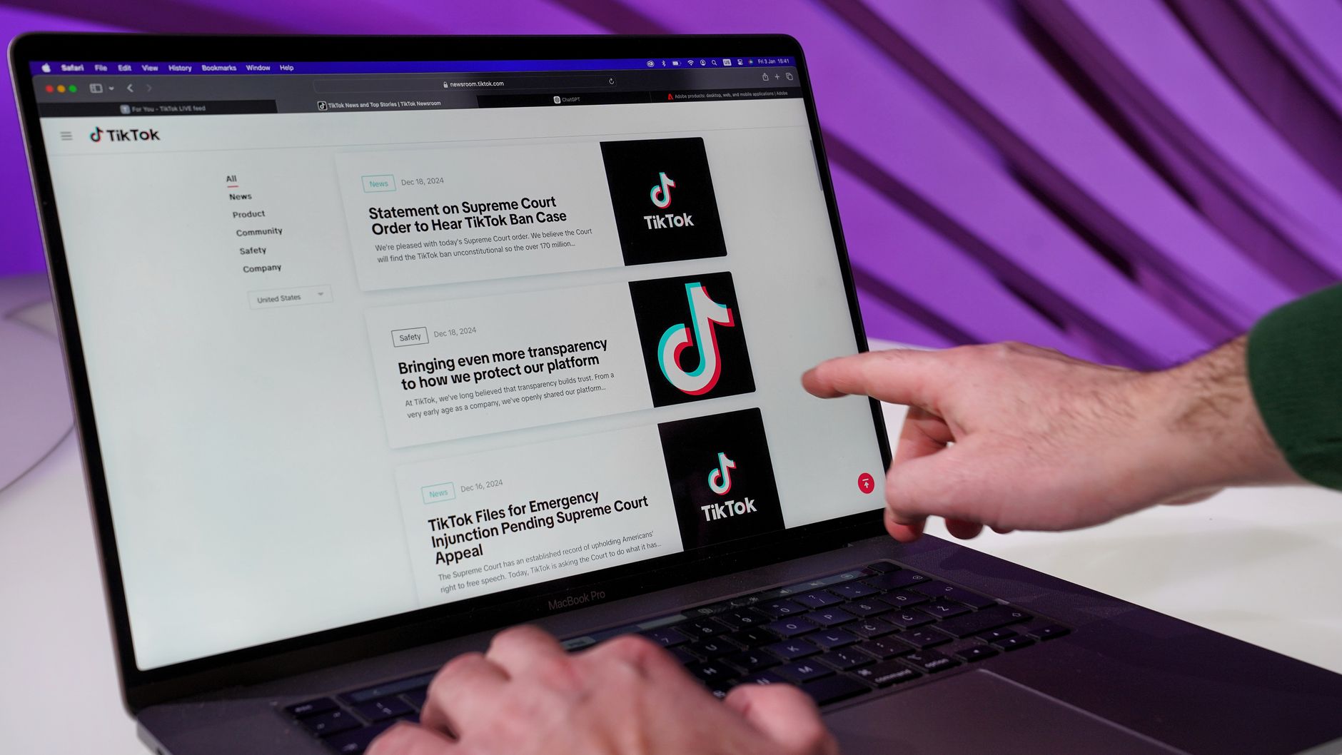 person browsing tiktok news on laptop screen