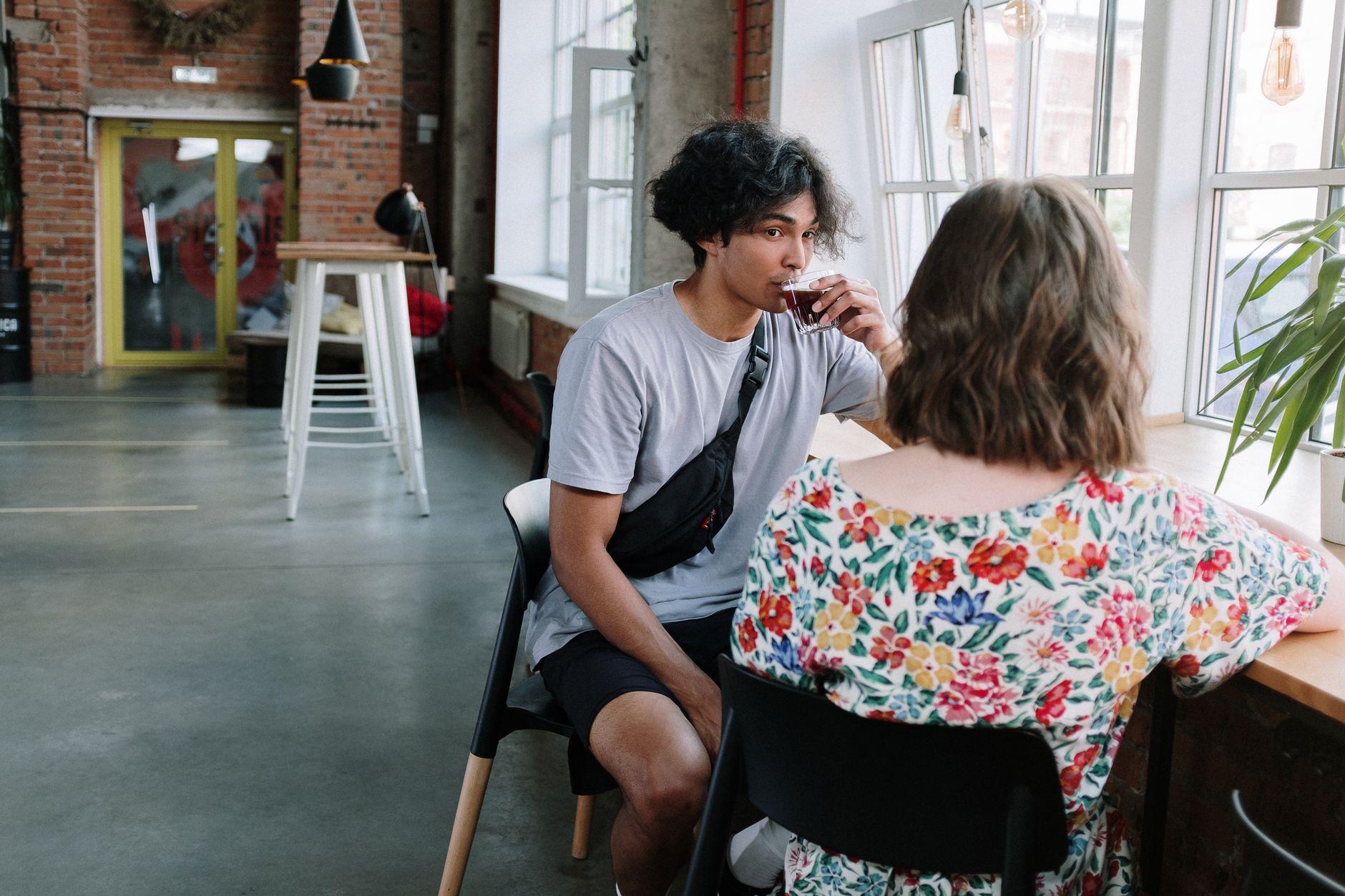 man in blue crew neck t shirt sitting on black chair