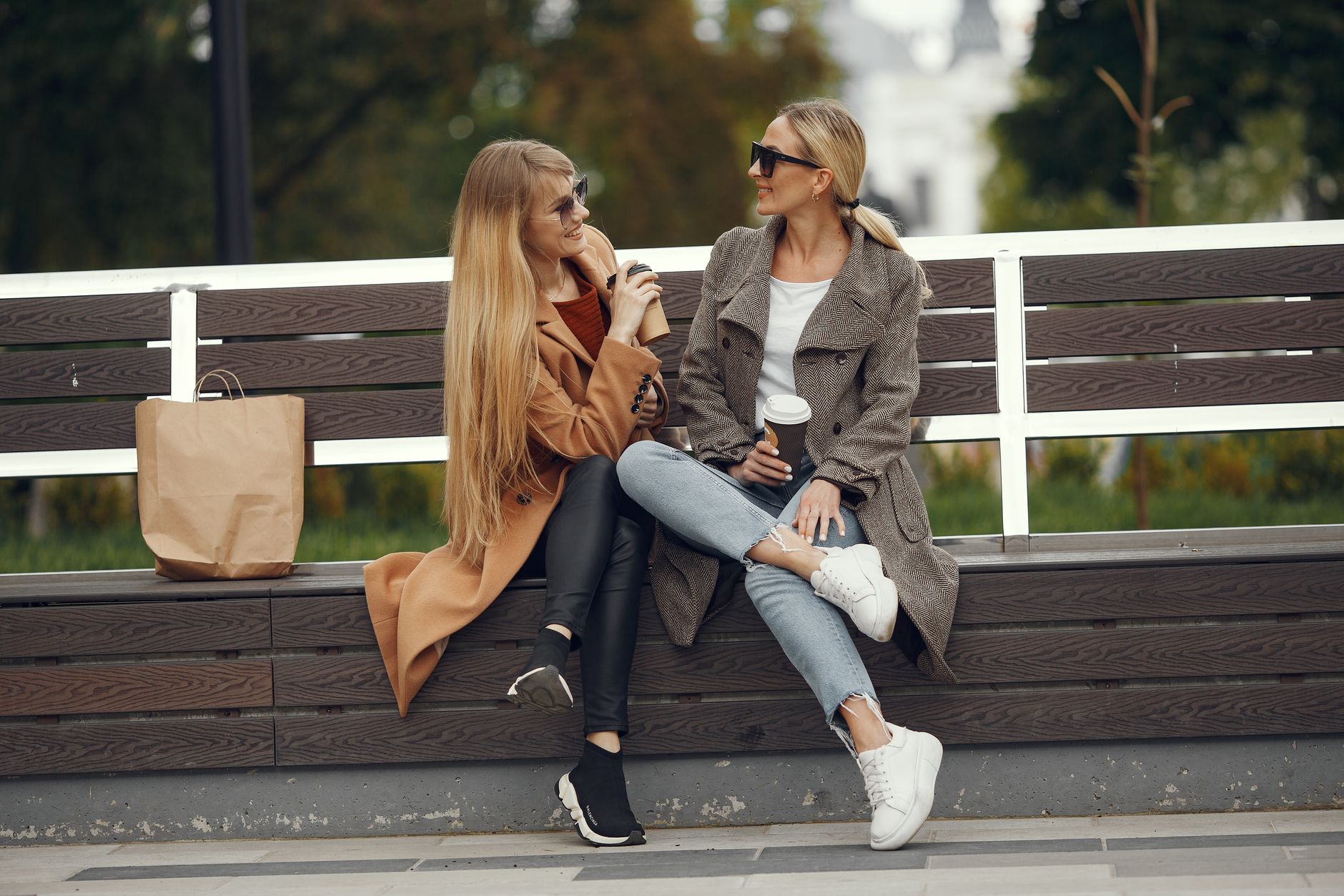blonde woman sitting on bench
