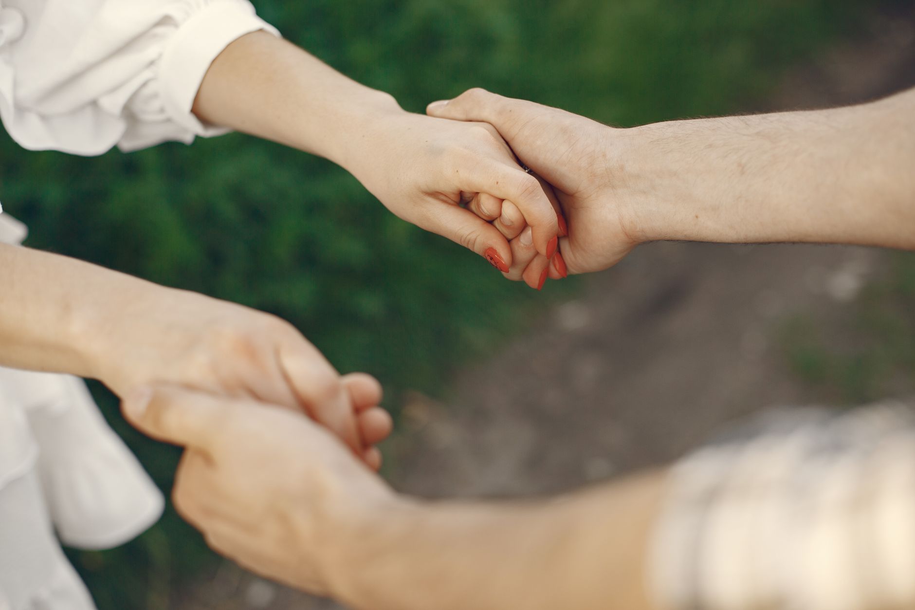 close up of couple holding hands
