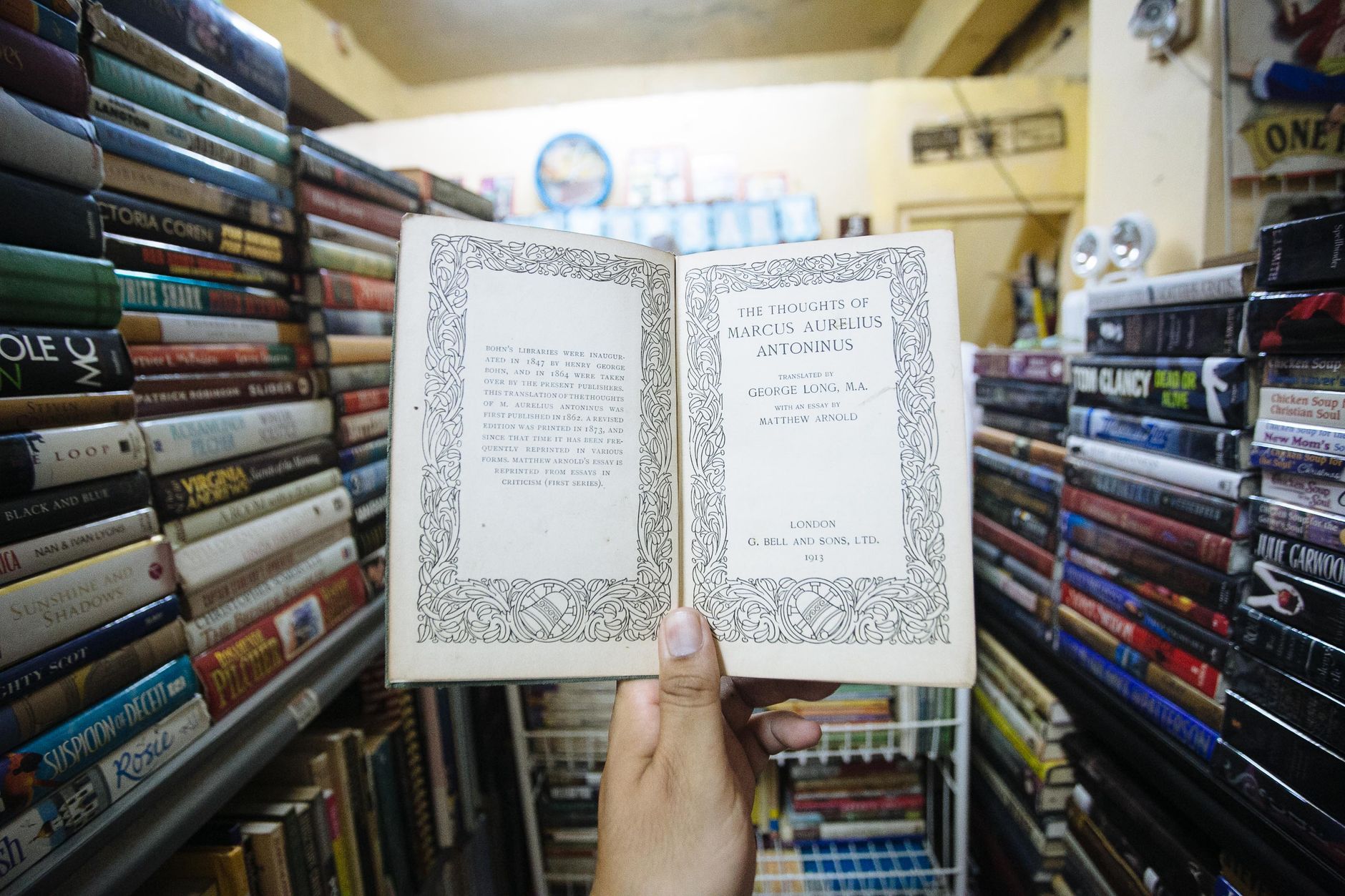 person holding open vintage book